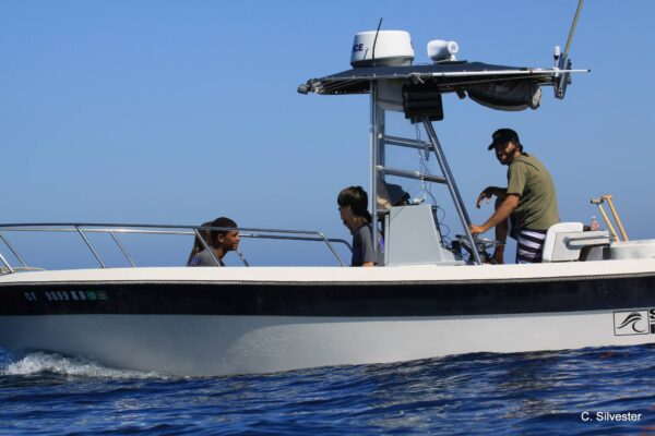 Sam driving an Escort Boat