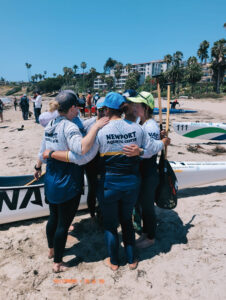 team hugging after race team hugging after race
